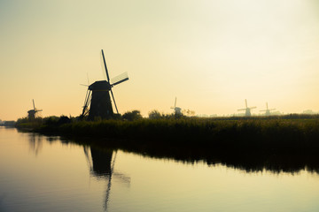 Fototapeta na wymiar Traditional dutch windmills in countryside at Kinderdijk, Rotter