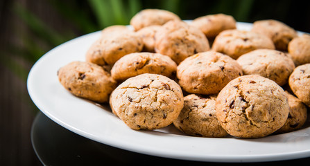 cookies with chocolate and raisins on a plate