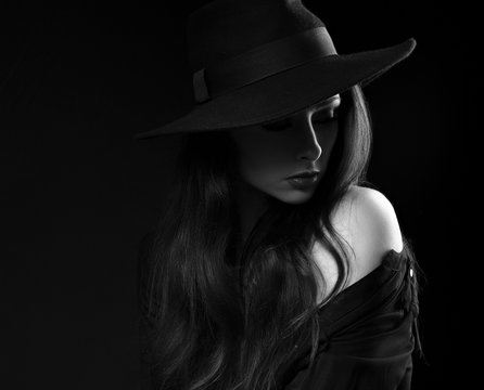 Beautiful long hair woman posing in black shirt and fashion eleg