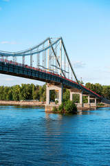 Riverscape in sunny day in Kiev, Ukraine. Peshehodniy most