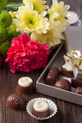 Fototapeta na wymiar chocolate candy and flowers