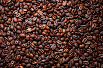 Coffee beans on wood background