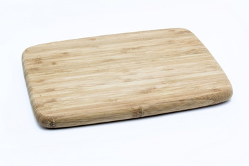 A wooden cutting board on a white background