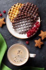 Coffee and waffles with berries