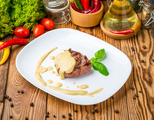 veal steak on a plate with sauce