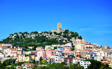 Obraz premium Panorama of Sardinia island with colorful houses and old stone fortress on top of a hill