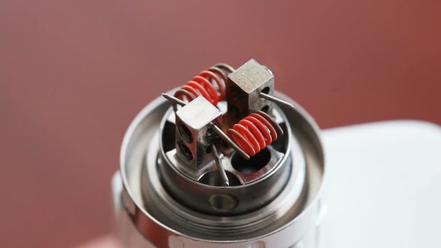 Macro video of burning spiral electronic cigarette