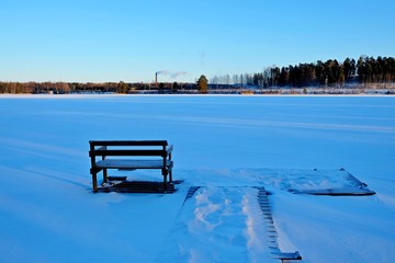 Berth in snow. Winter lake.