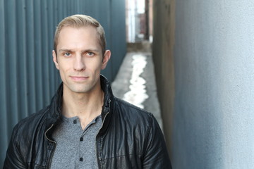 Handsome blond man close up with copy space 