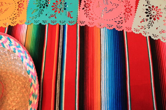 Mexican bunting poncho sombrero background fiesta cinco de mayo decoration papel de picado striped copy space pattern  stock, photo, photograph, image, picture