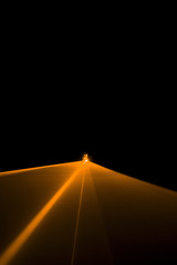 Laser beam orange on a black background