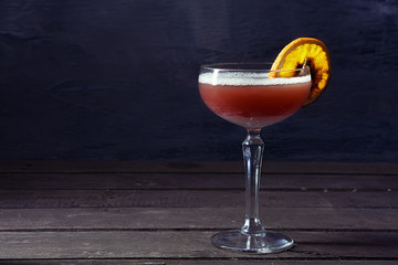Alcohol cocktail drink on the rustic background
