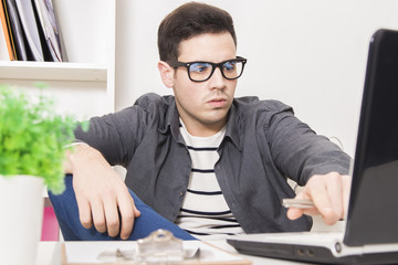 businessman using the laptop at home or in the office
