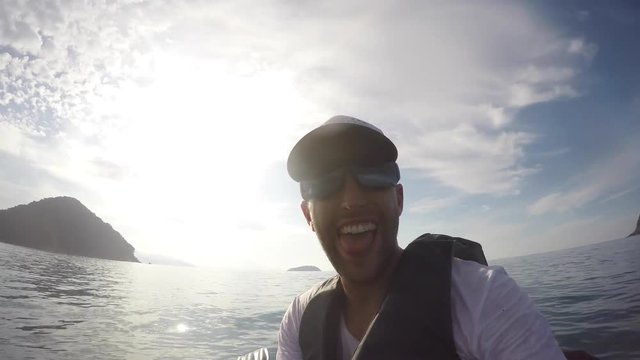 Man taking selfie on kayak in Brazil