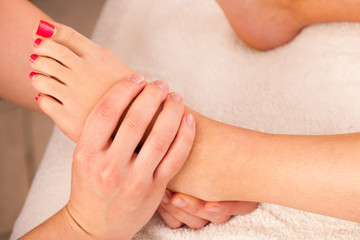 Foot massage in a wellness studio - spa