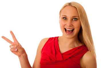 woman in red shows v sign for victory isolated over white