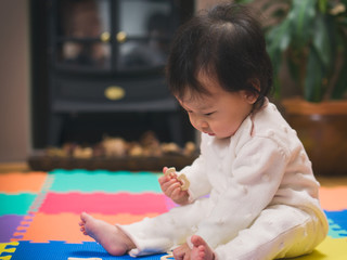 Asian baby girl learning English letters