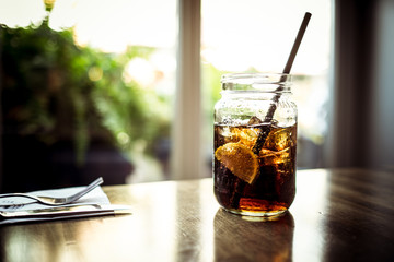 iced tea drink with lemon in a glass bottle