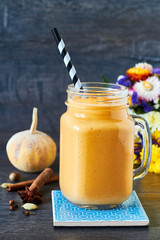 Healthy pumpkin spice smoothie with cream and caramel