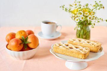 Rustic mini apricot tart on a summer table