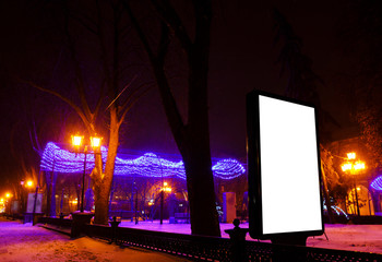 Mock up of billboard on the background of the night winter landscape