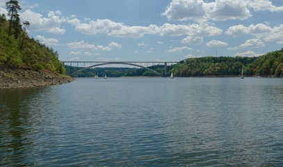 Water dam Orlik with a bridge and a yacht.
