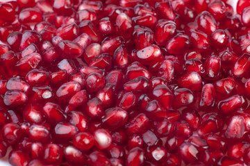 Texture of dark red pomegranate seeds
