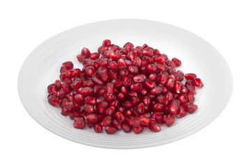 pomegranate grains on a white plate