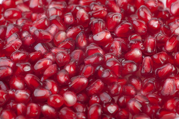 Texture of dark red pomegranate seeds