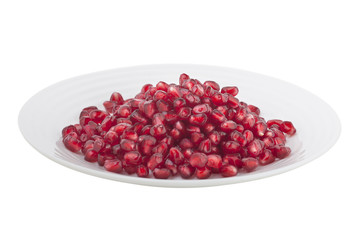 pomegranate grains on a white plate