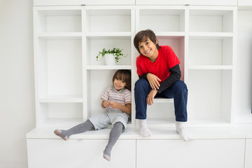 Child in shelf inside living room