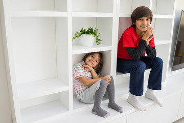 Child in shelf inside living room