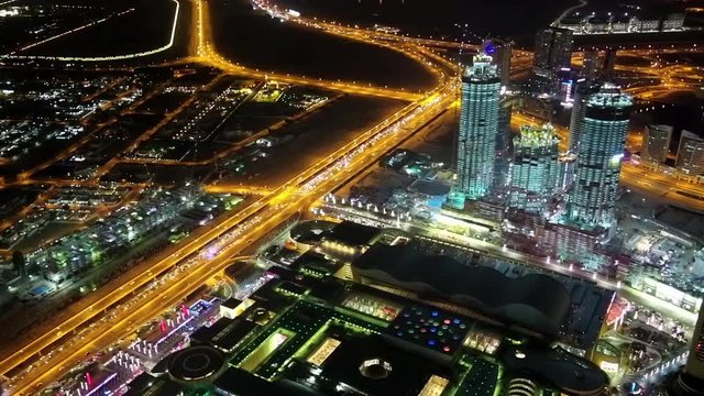 Dubai downtown at night, United Arab Emirates. View on Dubai Mall and Address hotel from the 124th floor of Burj Khalifa megatall skyscraper, currently the tallest structure in the world, 829,8 m