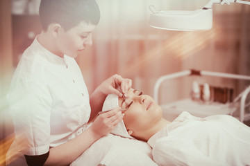 Obraz na płótnie Canvas Eyelash Extension Procedure. Woman Eye with Long Eyelashes