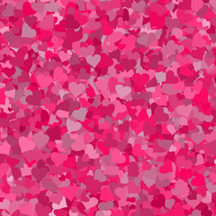 Abstract background with heart shapes on pink