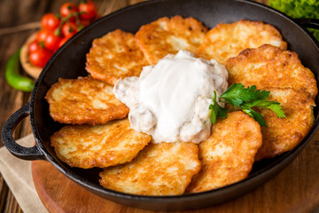 Fried savory pancakes with potato, onion and garlic
