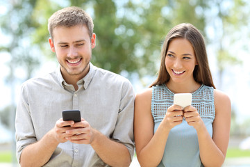 Couple or friends using smart phones