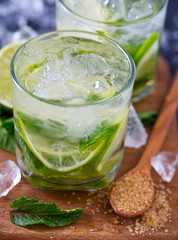 Mojito and ingredients, dark background