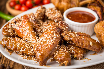 fried chicken wings and chicken legs in batter with ketchup and sauce