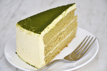Green tea cake on table