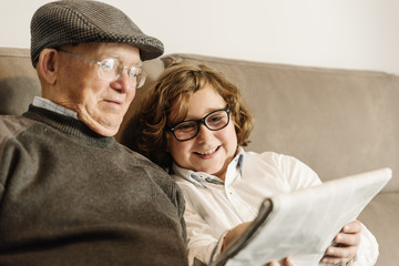 Grandfather and grandson are taking selfie.