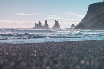 Iceland Vik coast on the black beach ocean shore with waves in winter and rock formations - 132769900