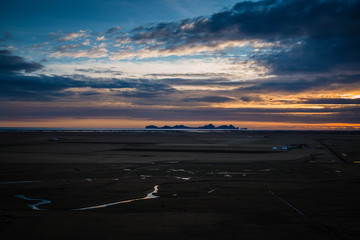 Iceland south coast landscape panorama at sunset orange and blue light