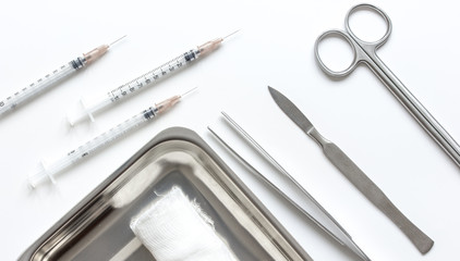 instruments for cosmetic surgery on white background top view