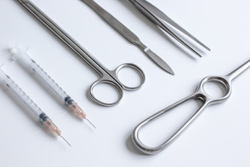 instruments for plastic surgery on white background