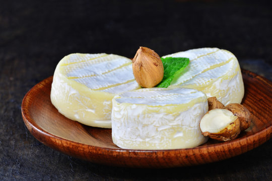 Brie cheese wheels with white mold