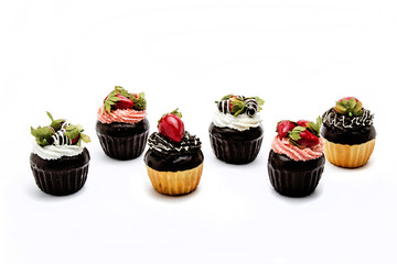 Chocolate Muffins with cup of coffee served with coffee beans ar