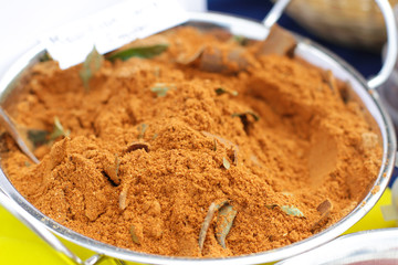 Curry Powder in the silver Bowl on the street market
