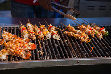 Freshly grilled giant lobsters. Lobster bbq, no claws. Street food.