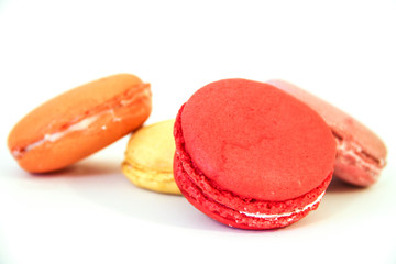 Four coloured Macarons on white background